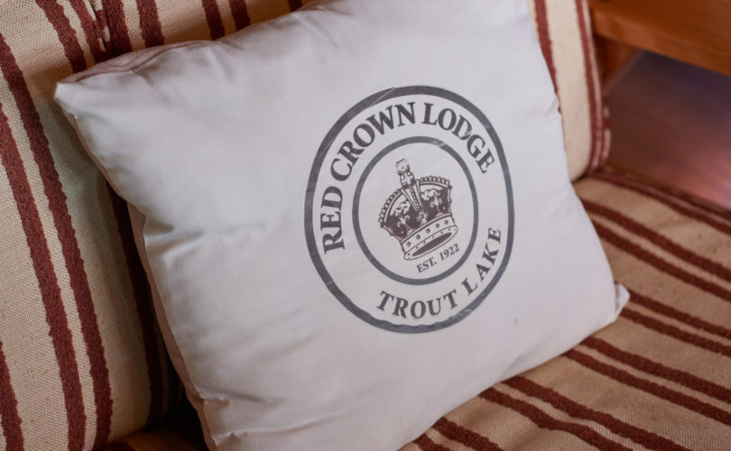 Pillow with Red Crown Lodge logo